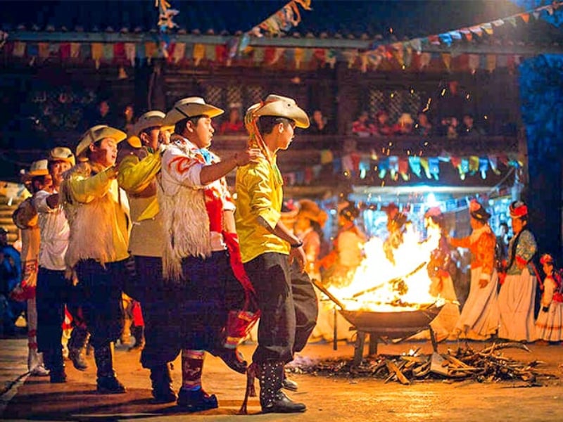 Yunnan ethnic bonfire festival with traditional costumes and dances, showcasing authentic intangible cultural heritage experiences