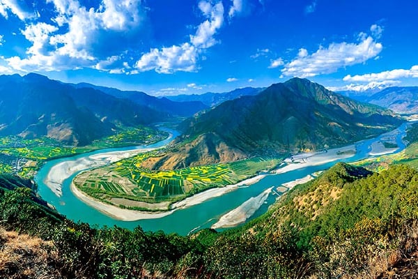 First Bend of the Yangtze River in Yunnan, showing a dramatic U-shaped river curve through highland mountains