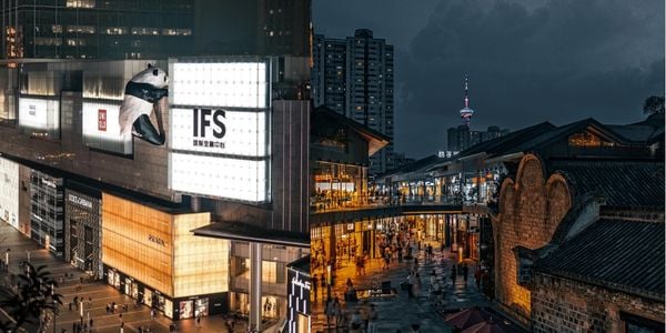 Chunxi Road night view in Chengdu with IFS panda sculpture and Taikoo Li, showing the city’s modern urban lifestyle