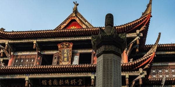 Wenshu Monastery in Chengdu with incense and temple courtyards, featuring a calm experience of worship, tea, scripture copying, and vegetarian meals